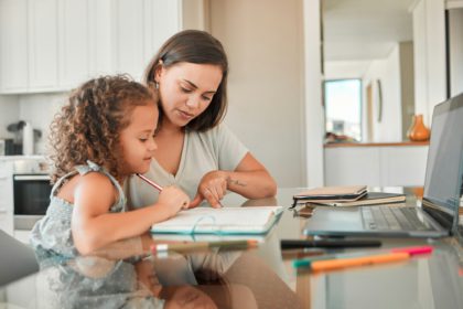 Mother, child and learning of parent helping her daughter with homework in the kitchen for educatio