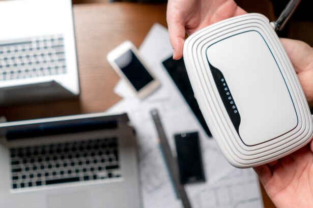 top view of group of people hold wi-fi router, wireless connection concept
