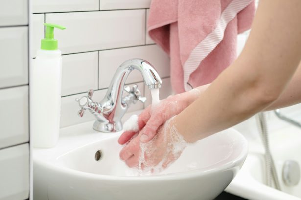 Washing hands with liquid soap under running water to protect against a dangerous virus